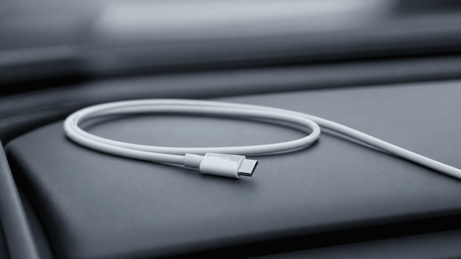 USB-C cable inserted into a Tesla Model Y dashboard USB-C port